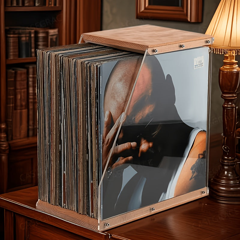 Wooden record crate with clear side panels, filled with vinyl records on a dark wood sideboard