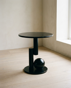Sphere Side Table with a round marbled top on a base of cylinder and sphere forms, on pale oak flooring