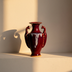 Two-handled amphora under a running oxblood drip glaze