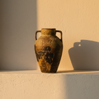 Two-handled amphora in mottled olive and ochre pottery