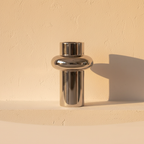 Mirror silver vase of stacked cylinders stepping toward the mouth