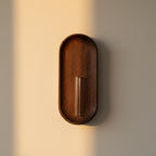 Walnut wall-mounted bud vase with a slim glass tube