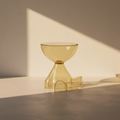 Ribbed amber acrylic side table glowing in low sun