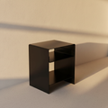 Matte black bedside table with two open shelves