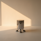 Polished steel cylinder side table on small ball feet