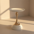 White side table on a polished gold stem and domed base