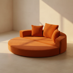 Circular burnt orange corduroy daybed with a low curved back
