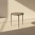 Round grey-topped side table on three fine splayed legs
