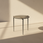 Round grey-topped side table on three fine splayed legs