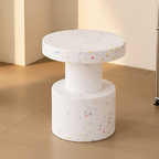 Round terrazzo side table flecked with fine colour