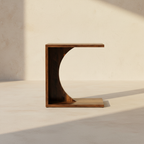 Walnut C-shaped side table cut as one continuous curve