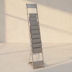 Freestanding brushed steel magazine rack with stepped pockets