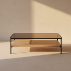 Smoked glass coffee table over a pale oak lower shelf