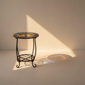 Wrought iron plant stand with a stained glass tree-of-life top