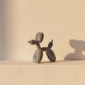 Balloon dog figure in a black and white checkerboard finish