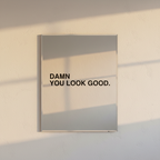 Black vinyl decal reading Damn You Look Good applied to a mirror