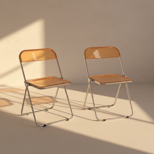 Pair of orange acrylic folding chairs in an empty plaster room