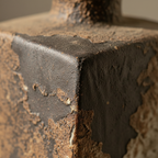 Macro detail of the mottled weathered surface at a corner edge
