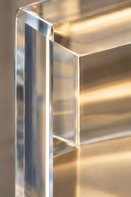 Close-up of the polished acrylic edge and its refracted light